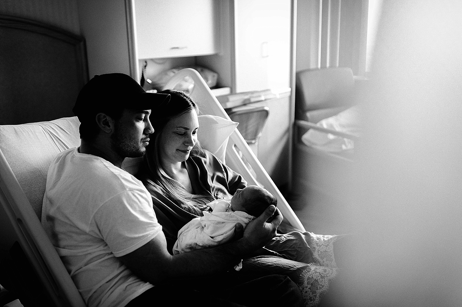 Parents adoring their newborn baby during Fresh48 session with Meg Newton Photography
