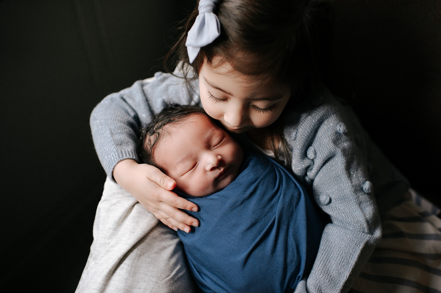Big sister with baby brother during Fresh 48 Session with Olympia Newborn Photographer, Meg Newton Photography