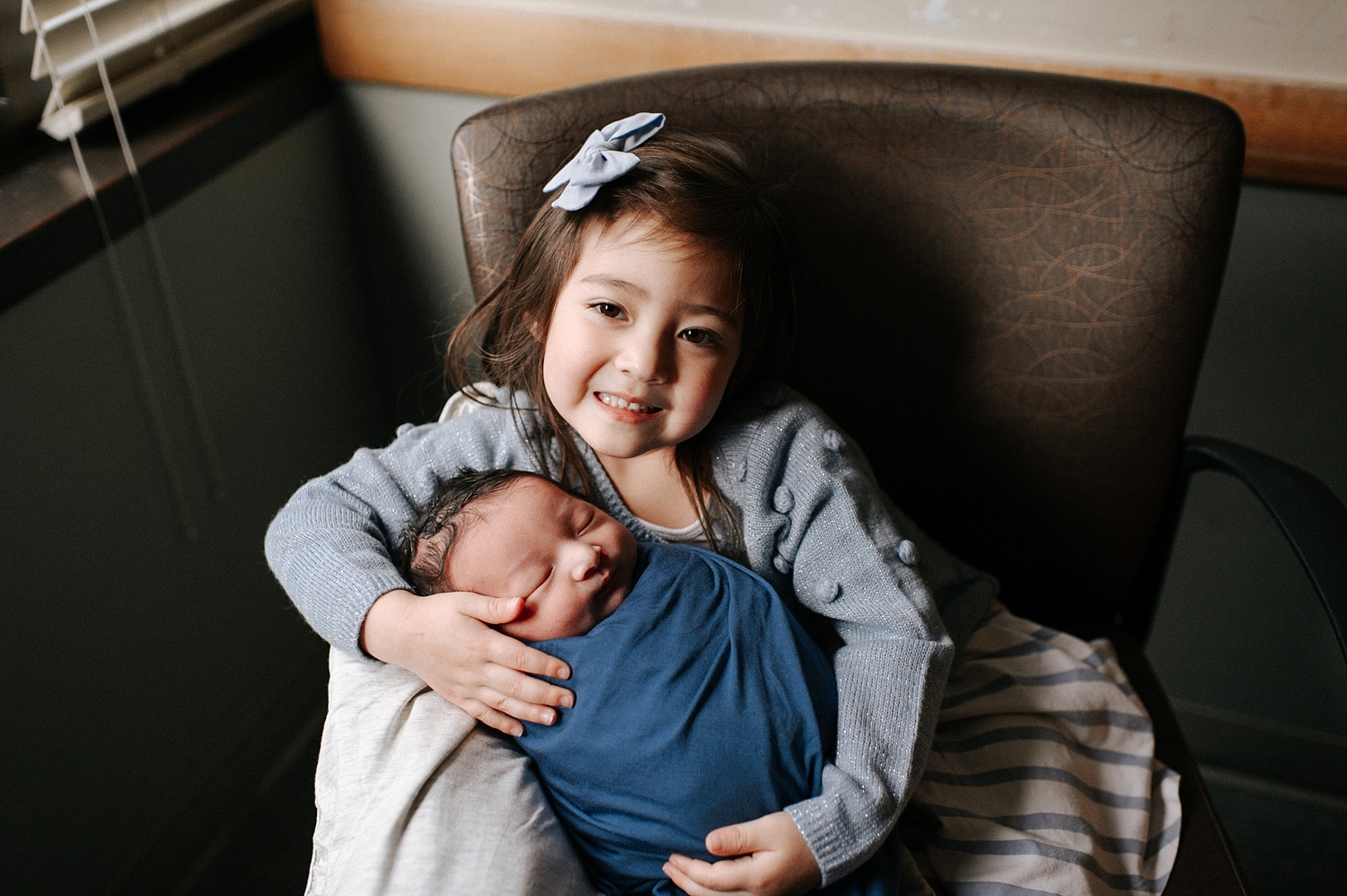 Big sister with baby brother during Fresh 48 Session with Olympia Newborn Photographer, Meg Newton Photography