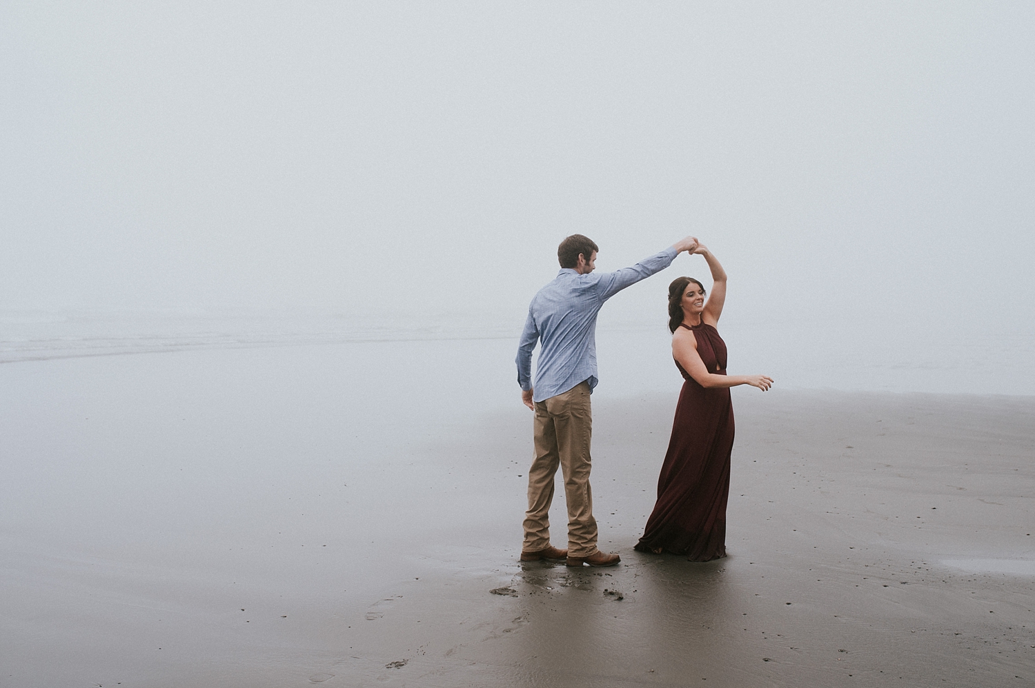 Couple dancing during engagement session on the Washington Coast | Meg Newton Photography