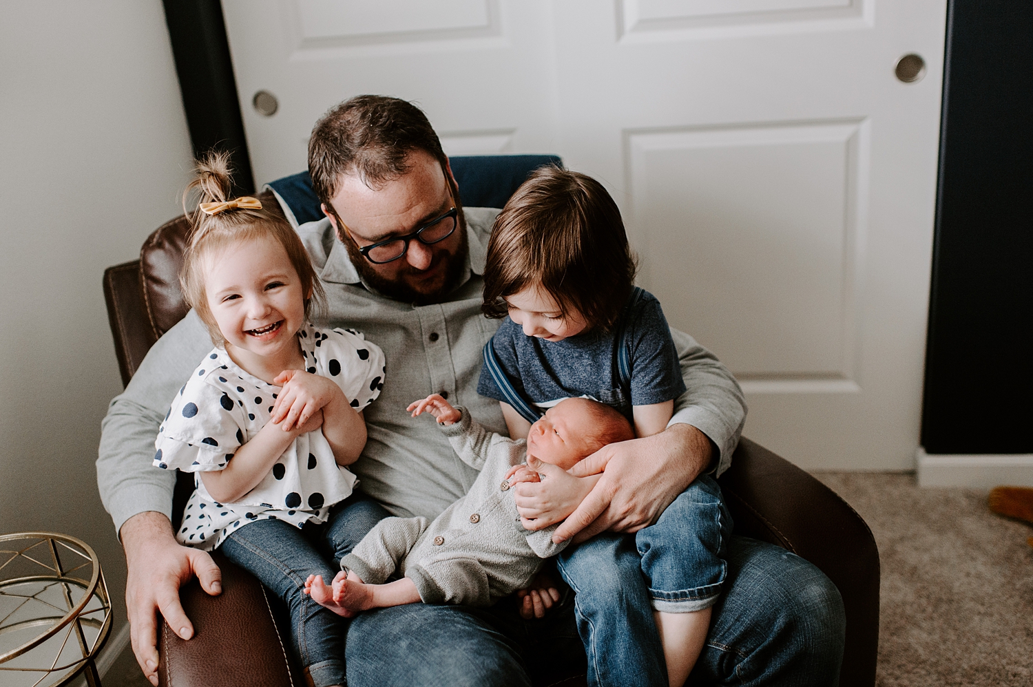 Daddy with three little ones during youngest sons lifestyle newborn photoshoot | Meg Newton Photography 