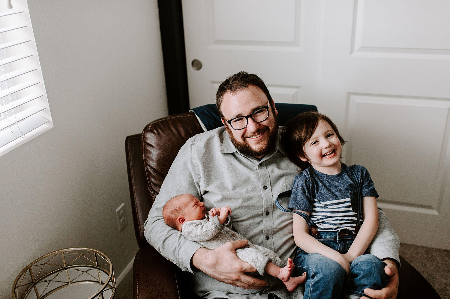 Dad and his two boys during youngest sons newborn lifestyle session | Meg Newton Photography 