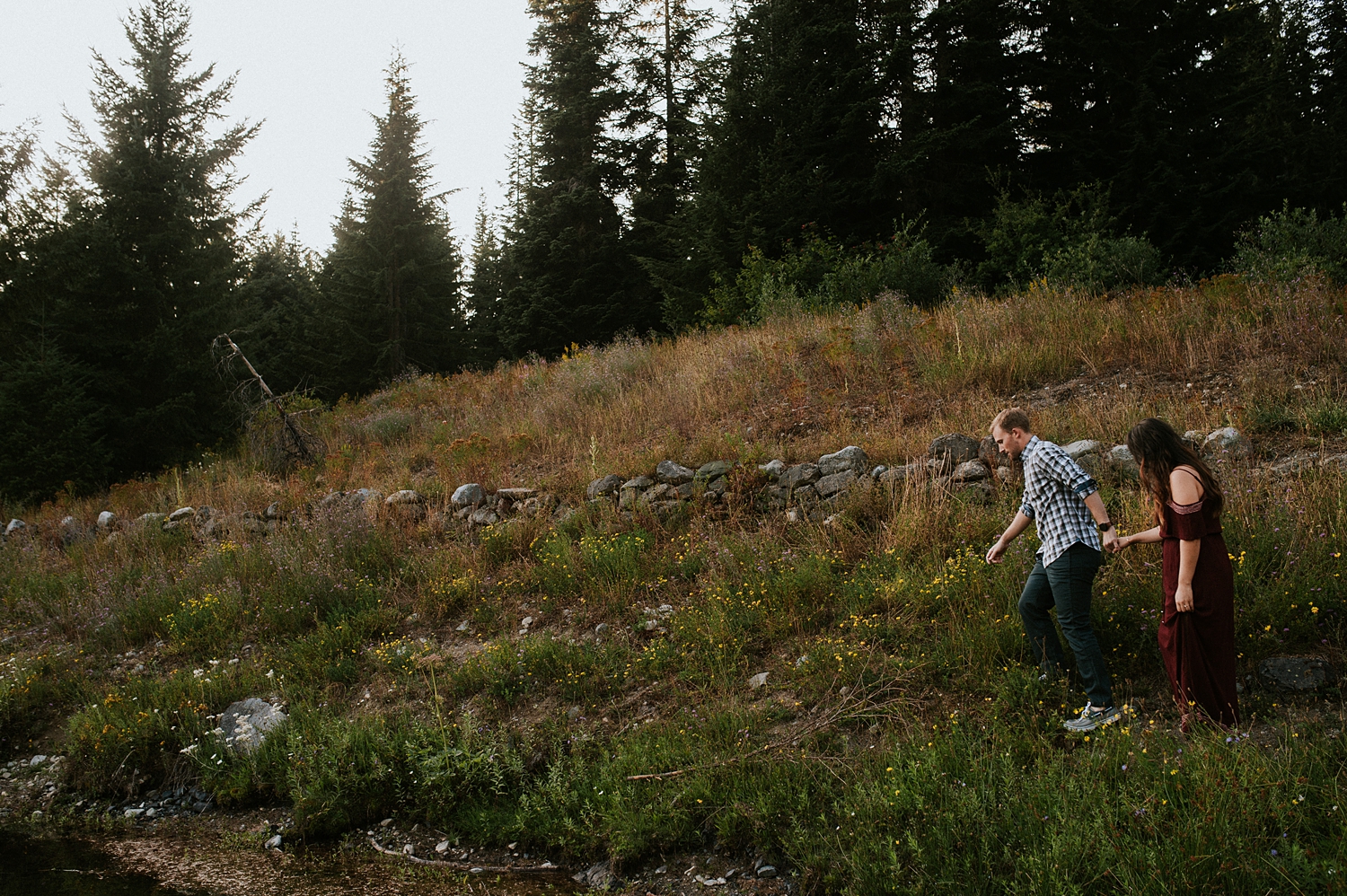 Couple exploring Gold Creek Pond during Seattle engagement session | Meg Newton Photography 