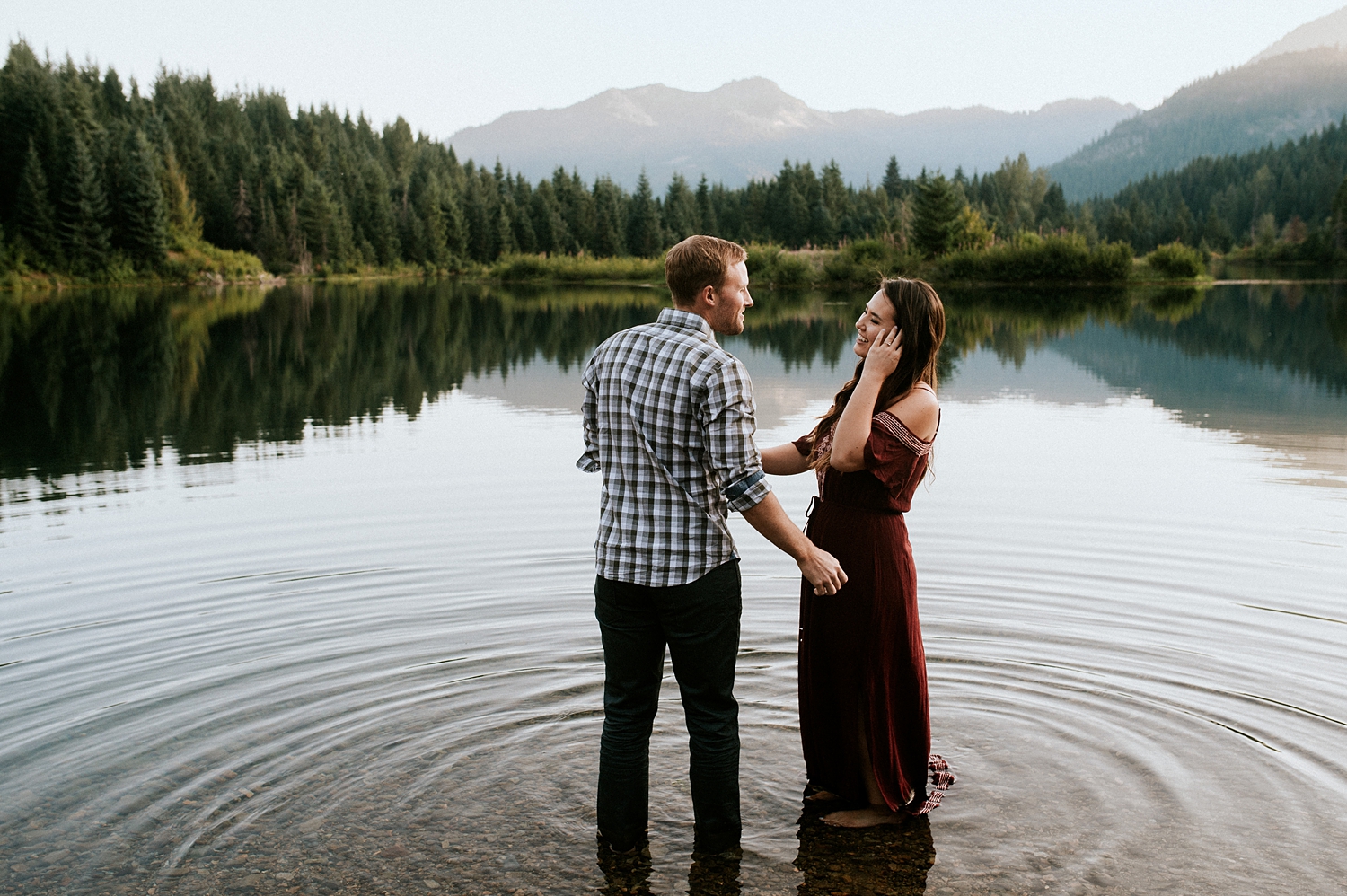 Couple in the water at Gold Creek Pond Engagement session | Meg Newton Photography 