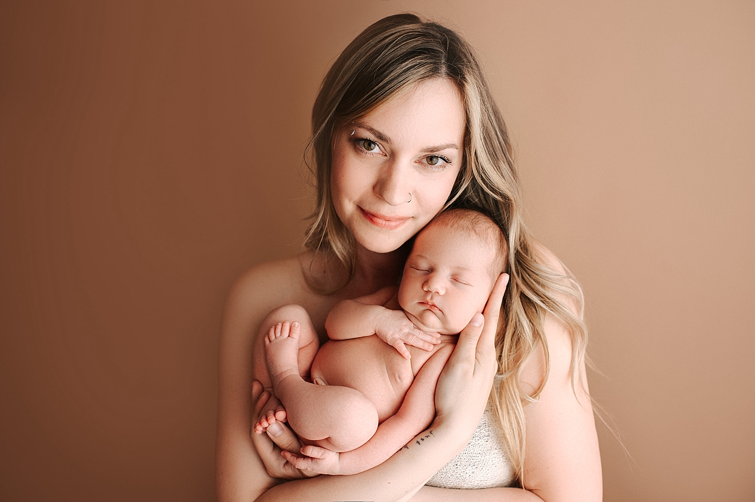 Mom and newborn baby girl during Tacoma Newborn Photoshoot with Meg Newton Photography
