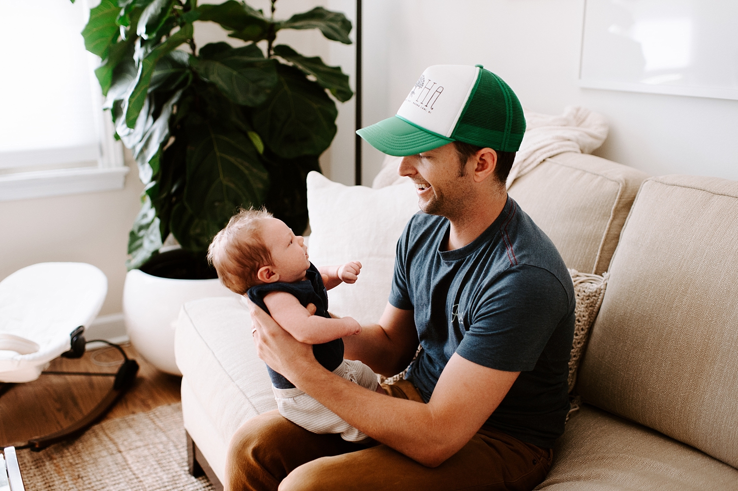 Dad with baby during Lifestyle Newborn Session with Seattle Newborn Photographer, Meg Newton Photography