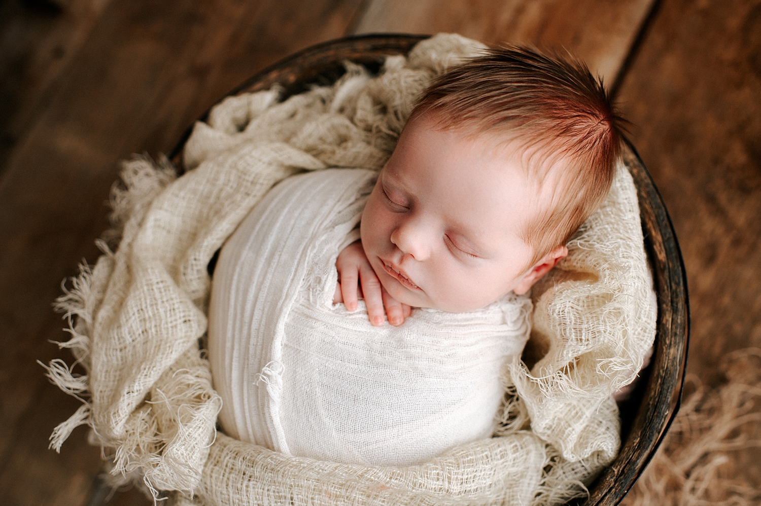 Newborn baby wrapped in basket for newborn session with Tacoma Baby Photographer, Meg Newton Photography 