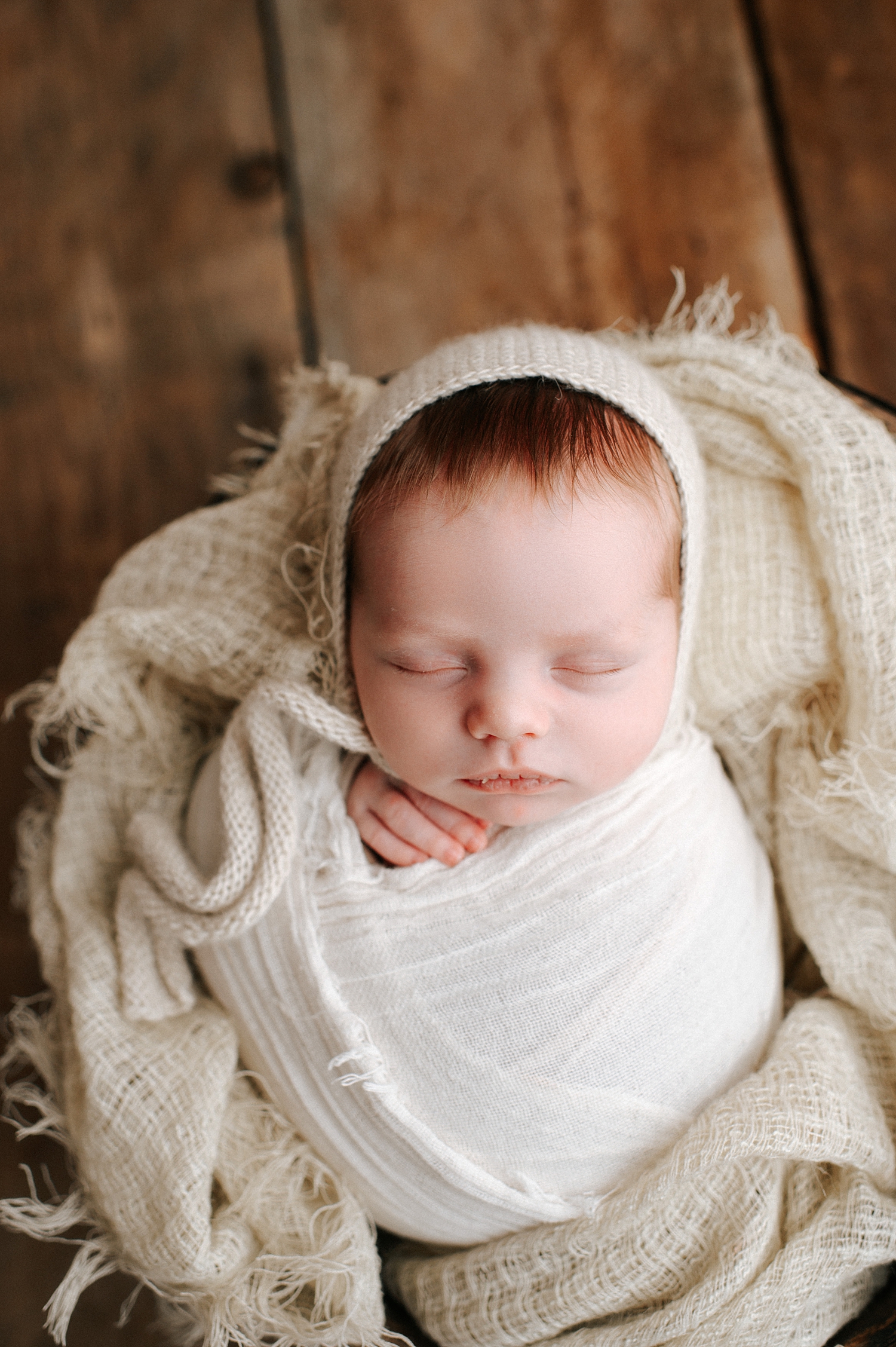 Potato sack newborn pose in basket with Tacoma Baby Photographer, Meg Newton Photography 