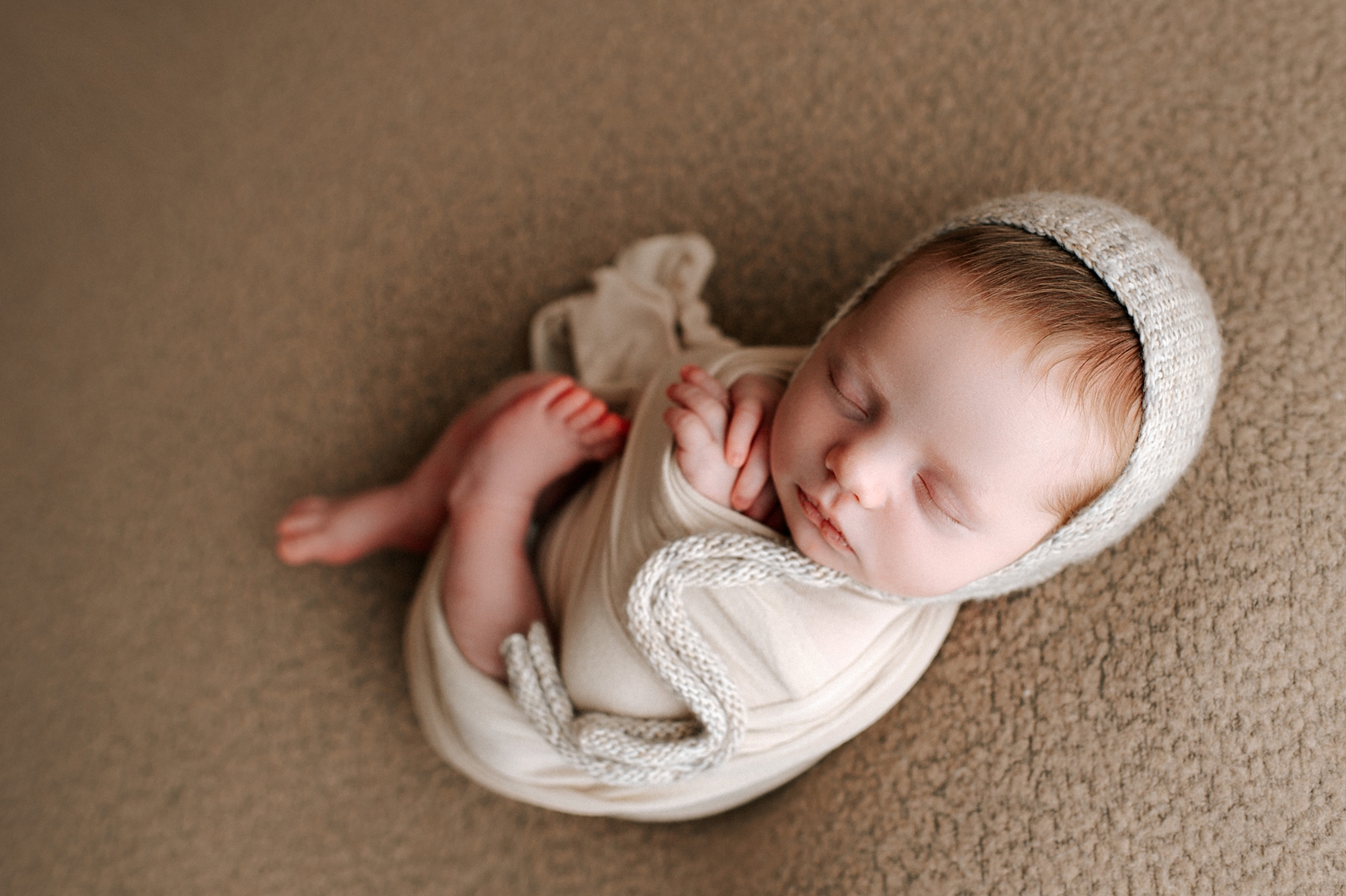 Newborn baby wrapped for newborn session with Tacoma Baby Photographer, Meg Newton Photography
