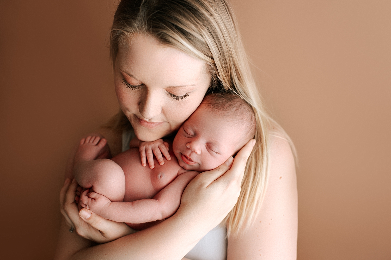Mom with newborn baby girl during posed newborn session with Tacoma Newborn Photographer, Meg Newton Photography