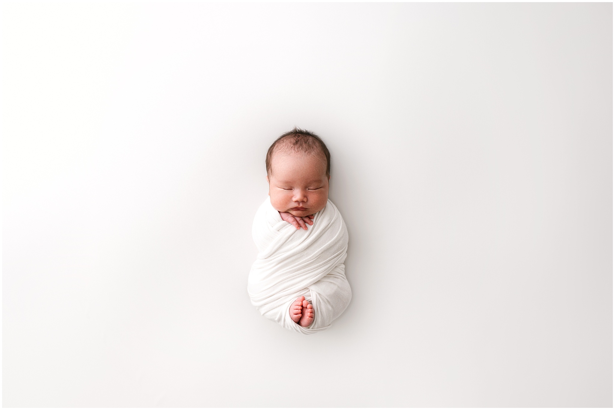 Pullback of newborn. Photo by Meg Newton Photography.