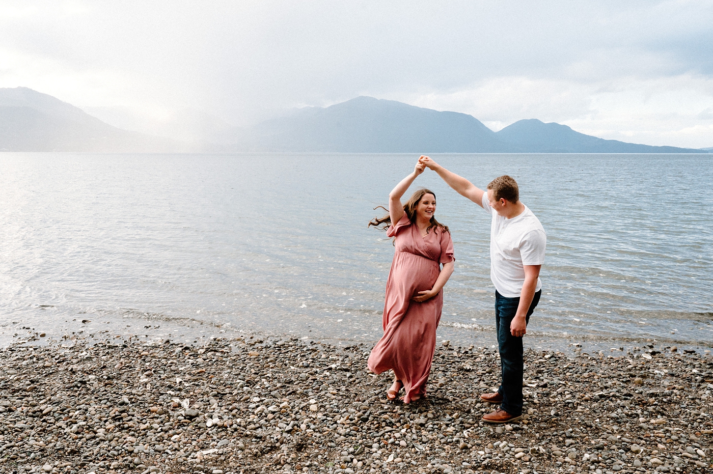 Parents dance during Gig Harbor maternity session. Photo by Meg Newton Photography.