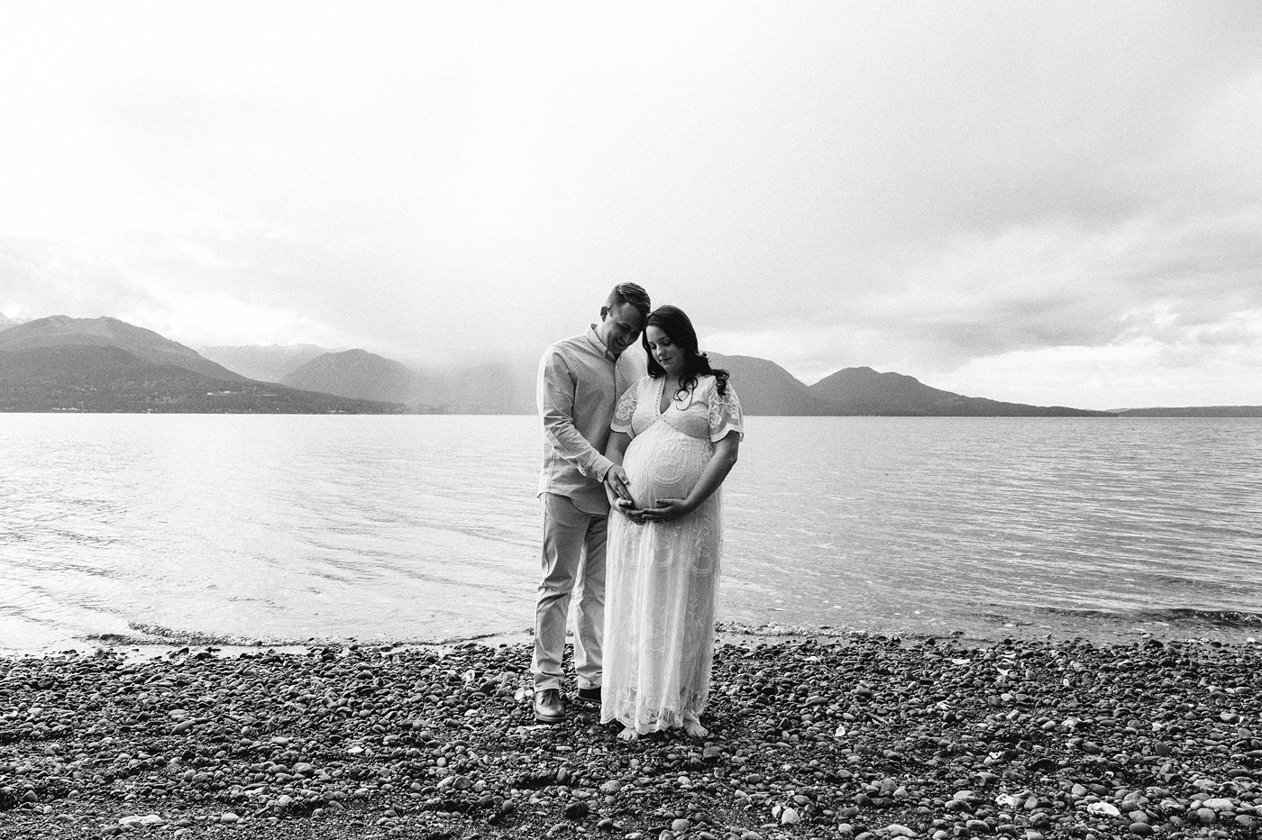 Parents to be in front of Hood Canal located in Washington. Photo by Meg Newton Photography.
