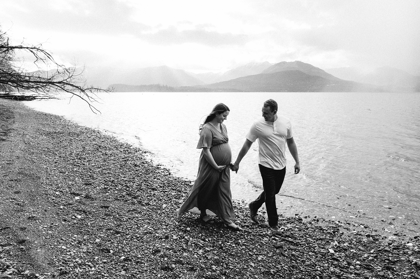 Mom and dad to be stroll along Hood Canal shoreline. Photo by Meg Newton Photography.