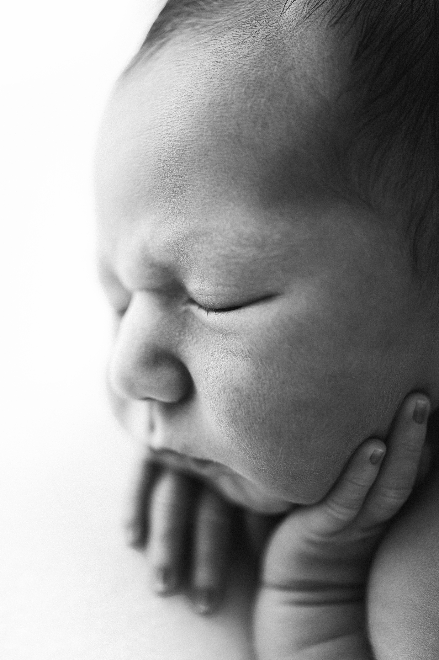 Macro shot os baby boy's face. Photo by Meg Newton Photography.
