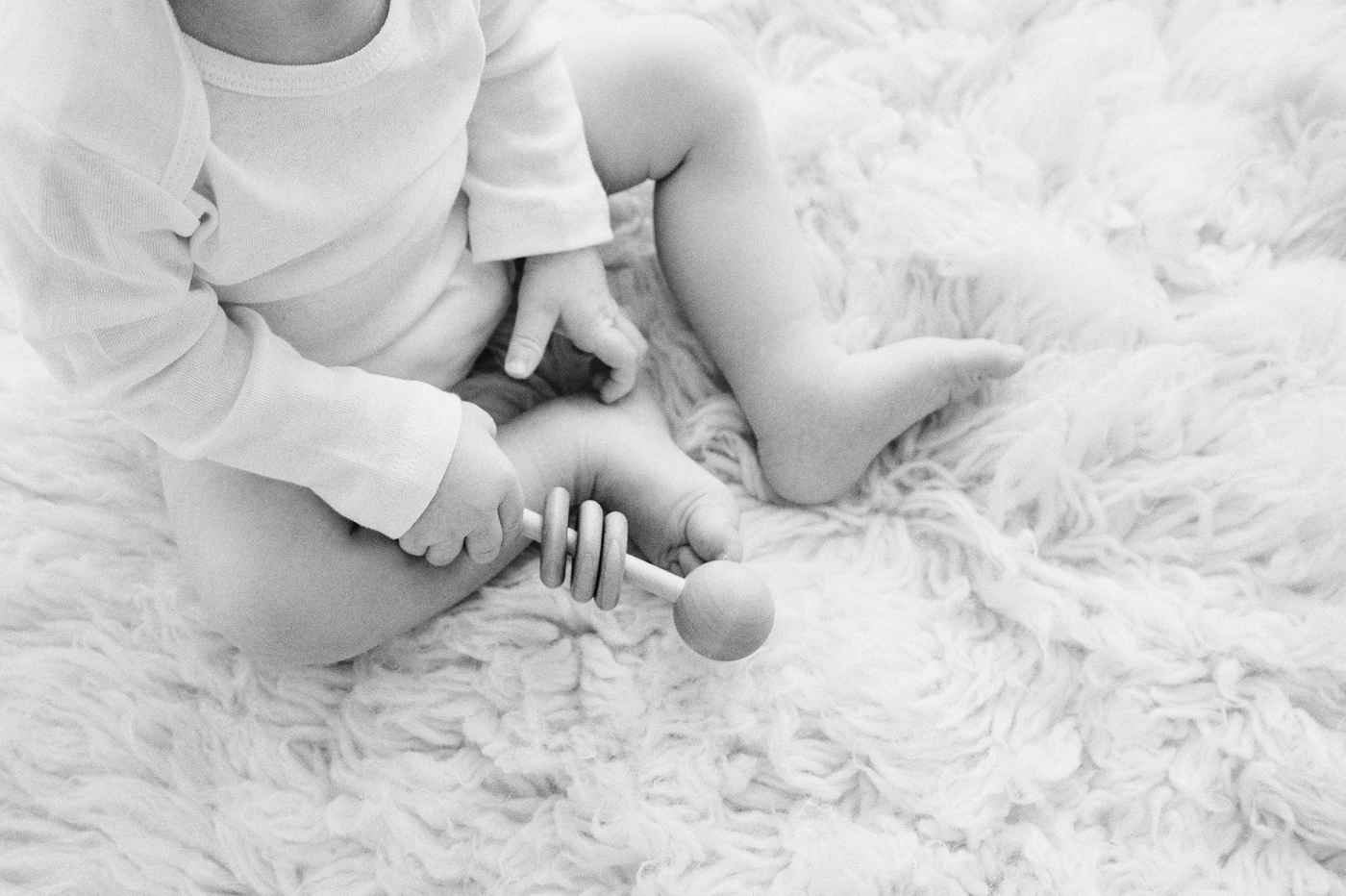 Black and white detail image of baby boy. Photo by Meg Newton Photography.