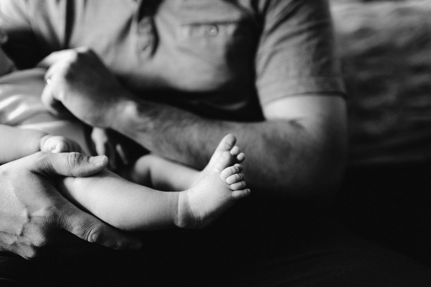 Sweet little black and white details of baby boy's feet. Photo by Meg Newton Photography.