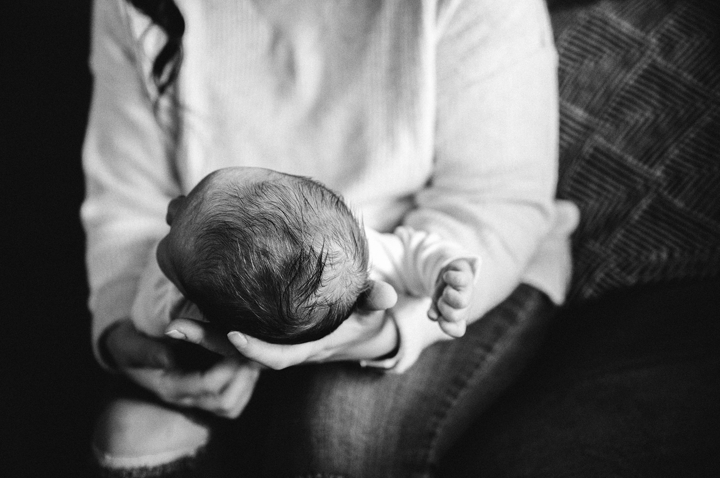 Black and white image of hair details on newborn baby boy. Photo by Meg Newton Photography.