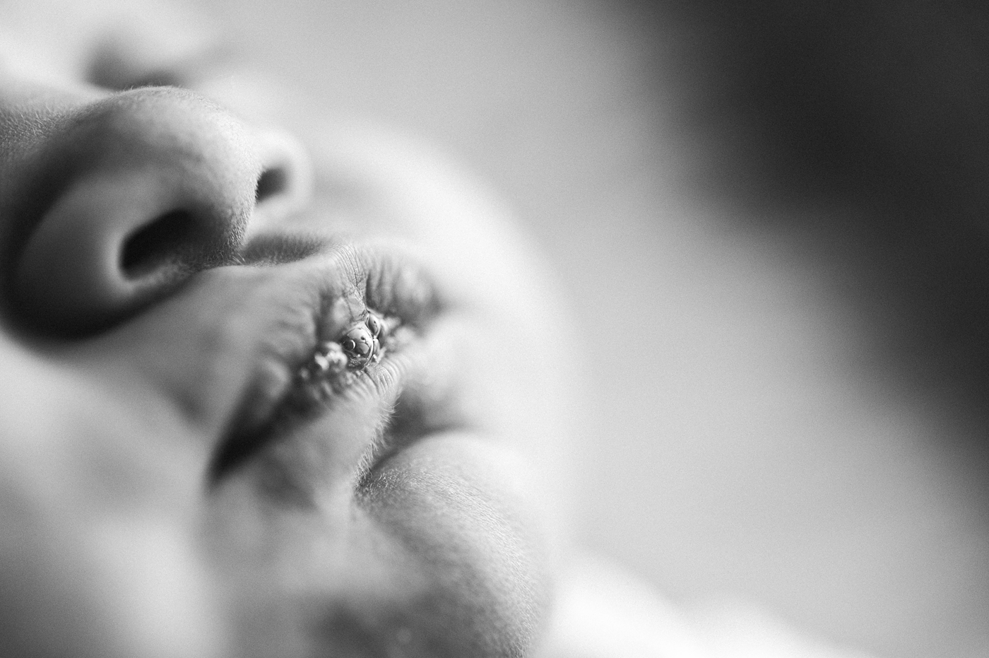 Macro shot of bubbles on a babies lips. Image by Meg Newton Photography.